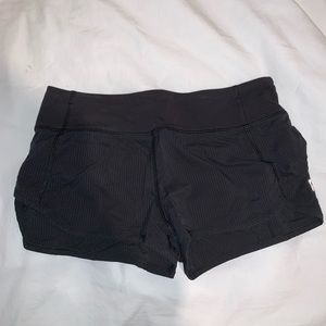 Girls black Ivivva running shorts
